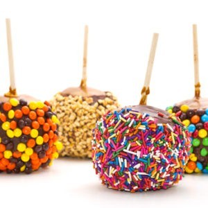 Caramel and Fudge Covered Apples with different toppings from Jenkinson's Sweet Shop.